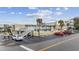 The building's exterior shows palm trees, a sign, and multiple levels with stairs and parking at 2600 S Ocean Blvd. # 215, Myrtle Beach, SC 29577