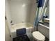 Traditional bathroom features a bathtub with blue accents and standard toilet at 2708 S Ocean Blvd. S # 302, Myrtle Beach, SC 29577
