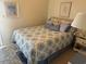 Comfortable bedroom with queen bed, patterned bedding, and soft lighting at 2708 S Ocean Blvd. S # 302, Myrtle Beach, SC 29577