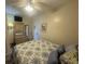 Cozy bedroom featuring a comfortable bed, dresser with mirror, and neutral wall colors at 2708 S Ocean Blvd. S # 302, Myrtle Beach, SC 29577