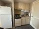 Compact kitchen with essential appliances, cabinets, and a neutral color scheme at 2708 S Ocean Blvd. S # 302, Myrtle Beach, SC 29577
