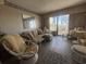 Cozy living room with comfortable seating and a balcony overlooking the city and ocean views at 2708 S Ocean Blvd. S # 302, Myrtle Beach, SC 29577