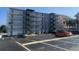 Exterior shot of a parking lot featuring multiple cars parked in marked parking spaces at 2708 S Ocean Blvd. S # 302, Myrtle Beach, SC 29577