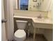 Bathroom with a toilet, a sink, and a shower in the background at 2708 S South Ocean Blvd. # 102, Myrtle Beach, SC 29577