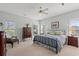 Inviting bedroom featuring stylish furniture, soft carpet, and ample natural light from the windows at 30 Baldwin Loop, Pawleys Island, SC 29585