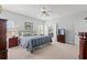Bedroom showcasing a queen bed, ceiling fan, and neutral tones that create a warm and welcoming space at 30 Baldwin Loop, Pawleys Island, SC 29585