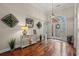 Inviting foyer boasts hardwood floors and a stylish console table with decor at 30 Baldwin Loop, Pawleys Island, SC 29585