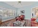 Inviting living room with an area rug, hardwood floors and natural light at 30 Baldwin Loop, Pawleys Island, SC 29585