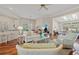 Spacious living area with hardwood floors and comfortable seating, leading into other rooms at 30 Baldwin Loop, Pawleys Island, SC 29585