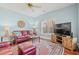 Cozy living room with a ceiling fan, hardwood floors, large clock and great lighting at 30 Baldwin Loop, Pawleys Island, SC 29585