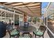 Inviting screened-in patio featuring comfortable seating, shade and view to the interior at 30 Baldwin Loop, Pawleys Island, SC 29585