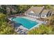 Aerial view of community pool with lounge chairs and meticulously kept landscaping at 30 Baldwin Loop, Pawleys Island, SC 29585