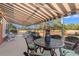 Relaxing screened-in porch with golf course views and an awning for shade at 30 Baldwin Loop, Pawleys Island, SC 29585