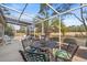 Relaxing screened-in porch with golf course views and a ceiling fan at 30 Baldwin Loop, Pawleys Island, SC 29585
