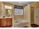 Relaxing bathroom featuring a soaking tub, separate shower, and modern fixtures at 300 Lorenzo Dr., North Myrtle Beach, SC 29582