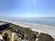 Serene beach view showcasing the ocean, sandy shore, and beautiful skyline at 300 Lorenzo Dr., North Myrtle Beach, SC 29582