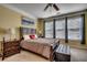 Comfortable bedroom featuring a large bed, two side tables, and an abundance of natural light at 300 Lorenzo Dr., North Myrtle Beach, SC 29582