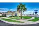 Charming home exterior with a well-manicured lawn, palm tree, and inviting curb appeal at 300 Lorenzo Dr., North Myrtle Beach, SC 29582