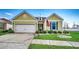 Charming home featuring a well-maintained lawn, inviting curb appeal, and an attached two-car garage at 300 Lorenzo Dr., North Myrtle Beach, SC 29582