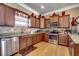 Modern kitchen with stainless steel appliances, granite countertops, and dark wood cabinetry at 300 Lorenzo Dr., North Myrtle Beach, SC 29582