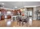 Open-concept kitchen and dining area featuring hardwood floors and stainless steel appliances at 300 Lorenzo Dr., North Myrtle Beach, SC 29582