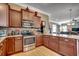 Stylish kitchen featuring stainless steel appliances, granite countertops, and dark cabinetry at 300 Lorenzo Dr., North Myrtle Beach, SC 29582