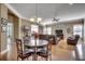 Bright and airy living room with hardwood floors, comfortable seating, and a view to the sunroom at 300 Lorenzo Dr., North Myrtle Beach, SC 29582
