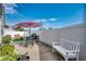 Inviting backyard patio with outdoor seating, umbrella, grill, and manicured landscaping at 300 Lorenzo Dr., North Myrtle Beach, SC 29582
