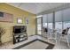 Bright sunroom with tile flooring, comfortable seating, and access to the outdoors at 300 Lorenzo Dr., North Myrtle Beach, SC 29582