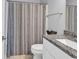Bathroom featuring neutral color patterned shower curtain and granite countertop at 3534 Pampas Dr. # 505, Myrtle Beach, SC 29577