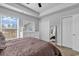 Tranquil bedroom with a large window, neutral decor, and ample closet space at 3534 Pampas Dr. # 505, Myrtle Beach, SC 29577