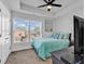 Cozy bedroom featuring a queen bed, ceiling fan, and large window at 3534 Pampas Dr. # 505, Myrtle Beach, SC 29577