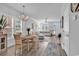 Open dining area with a chandelier, table set for four, and seamless flow to the living space at 3534 Pampas Dr. # 505, Myrtle Beach, SC 29577