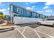 Exterior of a blue townhouse with white fence and reserved parking at 3534 Pampas Dr. # 505, Myrtle Beach, SC 29577