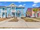 Charming two-story blue townhome with a quaint balcony and welcoming front entrance at 3534 Pampas Dr. # 505, Myrtle Beach, SC 29577