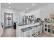 Kitchen featuring granite countertops, a breakfast bar with seating, and modern appliances at 3534 Pampas Dr. # 505, Myrtle Beach, SC 29577