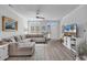 Cozy living room with a large sectional sofa, natural light, and modern entertainment center at 3534 Pampas Dr. # 505, Myrtle Beach, SC 29577