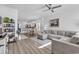 Inviting living area featuring a comfortable gray sectional sofa, light wood floors, and white walls at 3534 Pampas Dr. # 505, Myrtle Beach, SC 29577