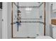 This is a shower featuring white subway tile, mosaic accents, and a glass door at 3534 Pampas Dr. # 505, Myrtle Beach, SC 29577
