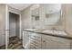 This bathroom has an attractive double vanity, wood-look flooring, and great lighting at 3685 Nichols Hwy., Aynor, SC 29511