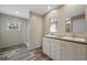Bathroom with double sink vanity, walk-in shower, and vinyl flooring at 3685 Nichols Hwy., Aynor, SC 29511