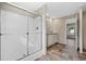 Bathroom featuring a shower with glass door, sink with vanity, and vinyl flooring at 3685 Nichols Hwy., Aynor, SC 29511