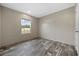 This bedroom features stylish wood-look flooring and a window letting in natural light at 3685 Nichols Hwy., Aynor, SC 29511