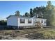 Charming single-story home with white siding, black shutters, and a stone foundation at 3685 Nichols Hwy., Aynor, SC 29511