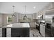 Kitchen with stainless appliances, island, sink and view from windows at 3685 Nichols Hwy., Aynor, SC 29511