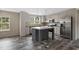 Well-lit kitchen featuring stainless steel appliances, ample cabinet space, and a center island at 3685 Nichols Hwy., Aynor, SC 29511