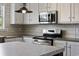 Bright kitchen features stainless steel appliances and white wood cabinets at 3685 Nichols Hwy., Aynor, SC 29511