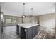 Open-concept kitchen with a large center island, modern pendant lighting, and stainless steel appliances at 3685 Nichols Hwy., Aynor, SC 29511