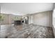 An open floor plan with vinyl flooring and natural light to living room and kitchen at 3685 Nichols Hwy., Aynor, SC 29511