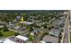 Aerial view of a condo complex with a pool, parking area, and mature landscaping at 405 21St Ave. S # 1-O, North Myrtle Beach, SC 29582